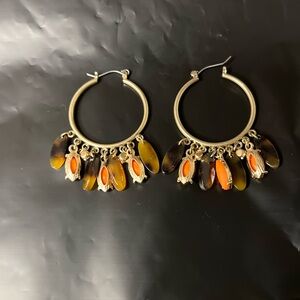 Earrings with brown, orange oval pendants